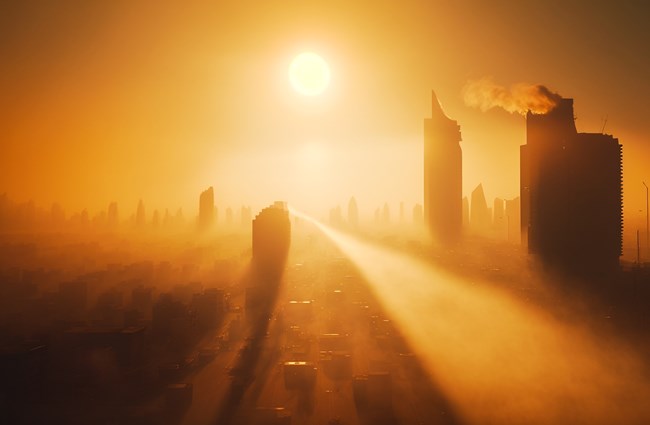 A hazy cityscape with bright sunshine