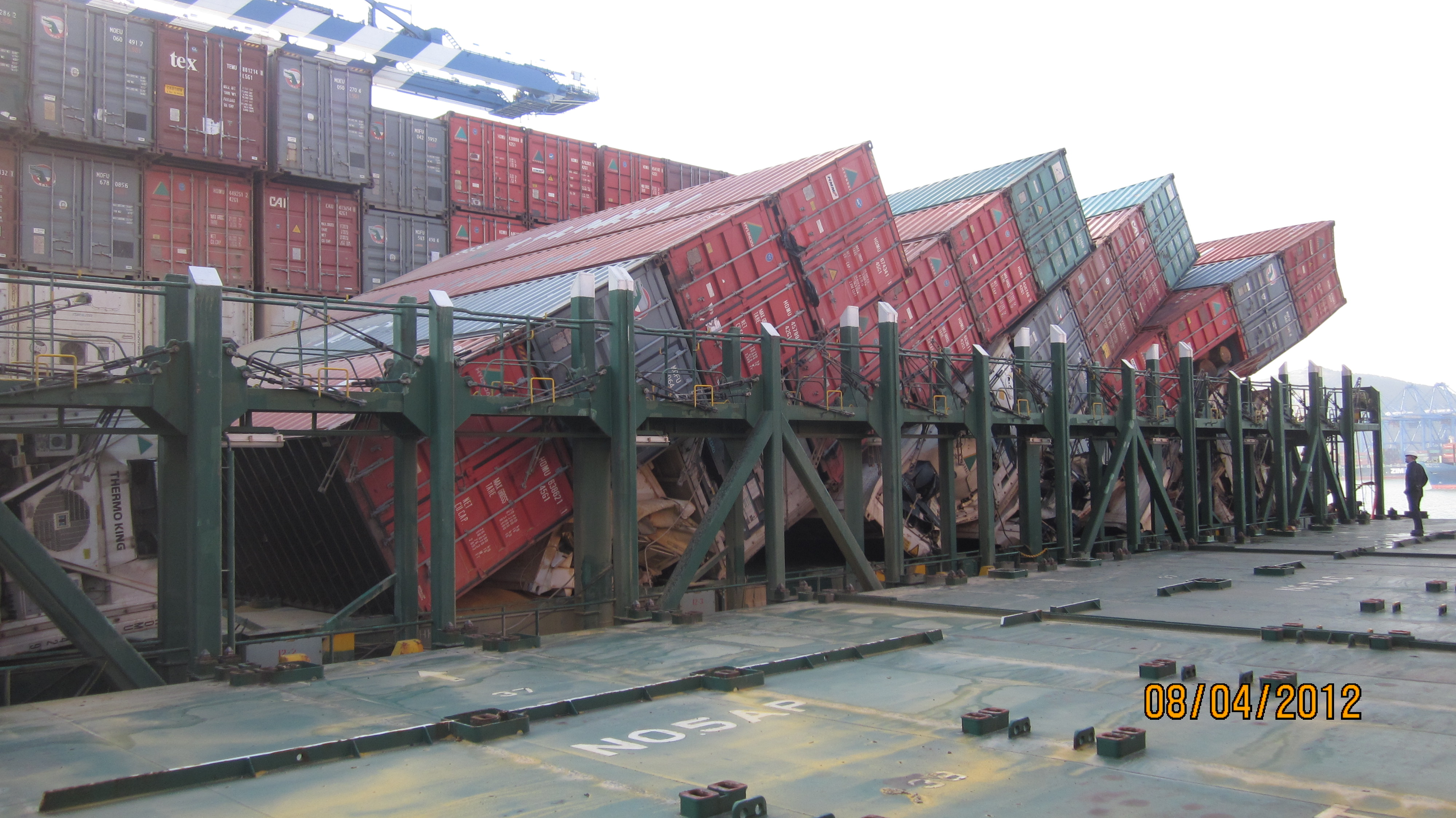 Image of containers that have collapsed on a ship