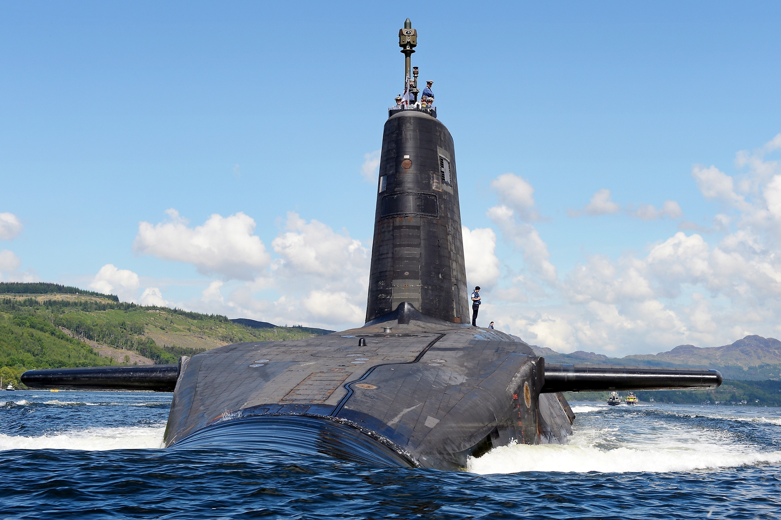 Picture of a submarine breaking through the water line