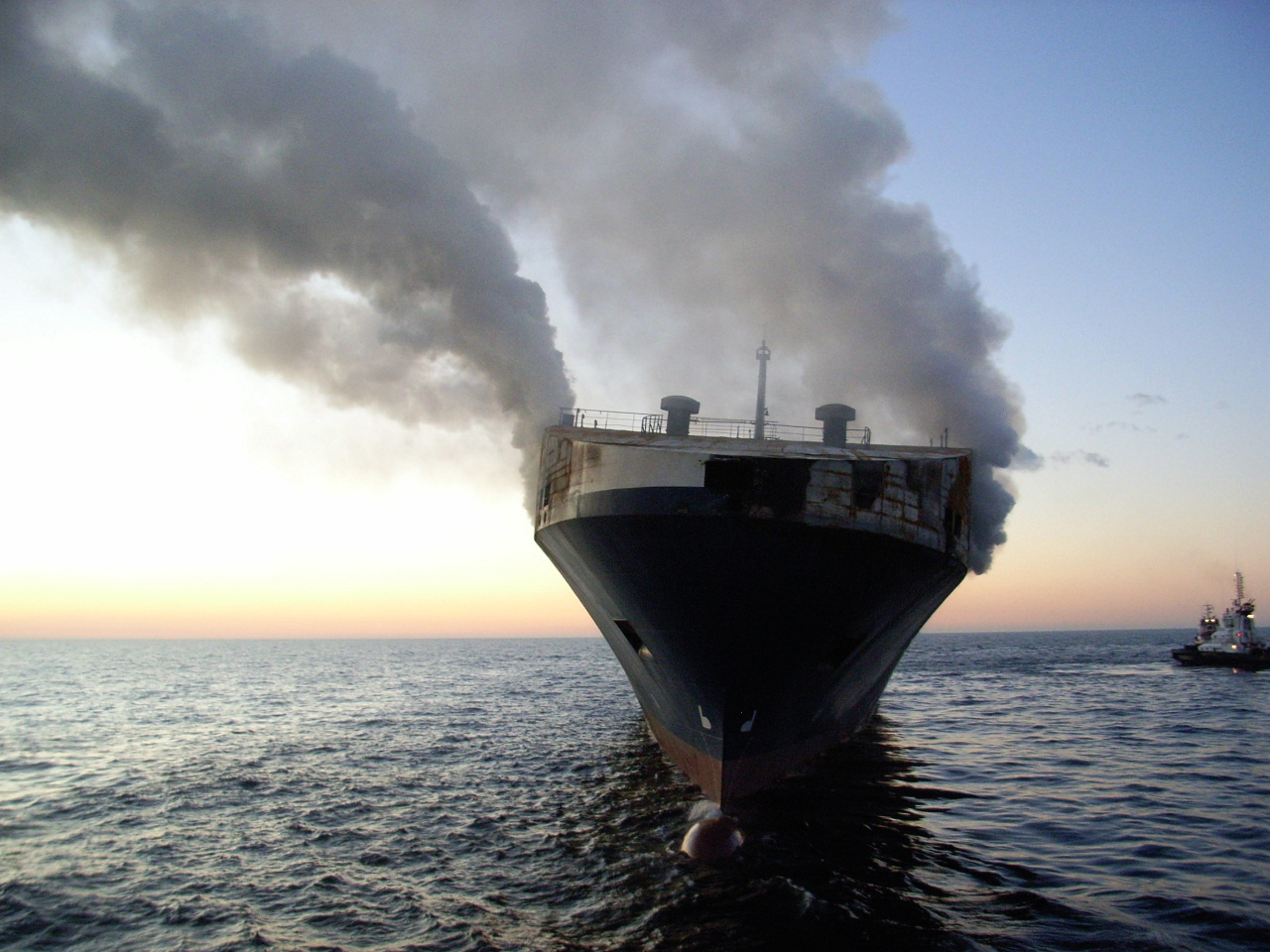 Container ship on fire in open sea