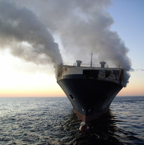 Container ship on fire in open sea