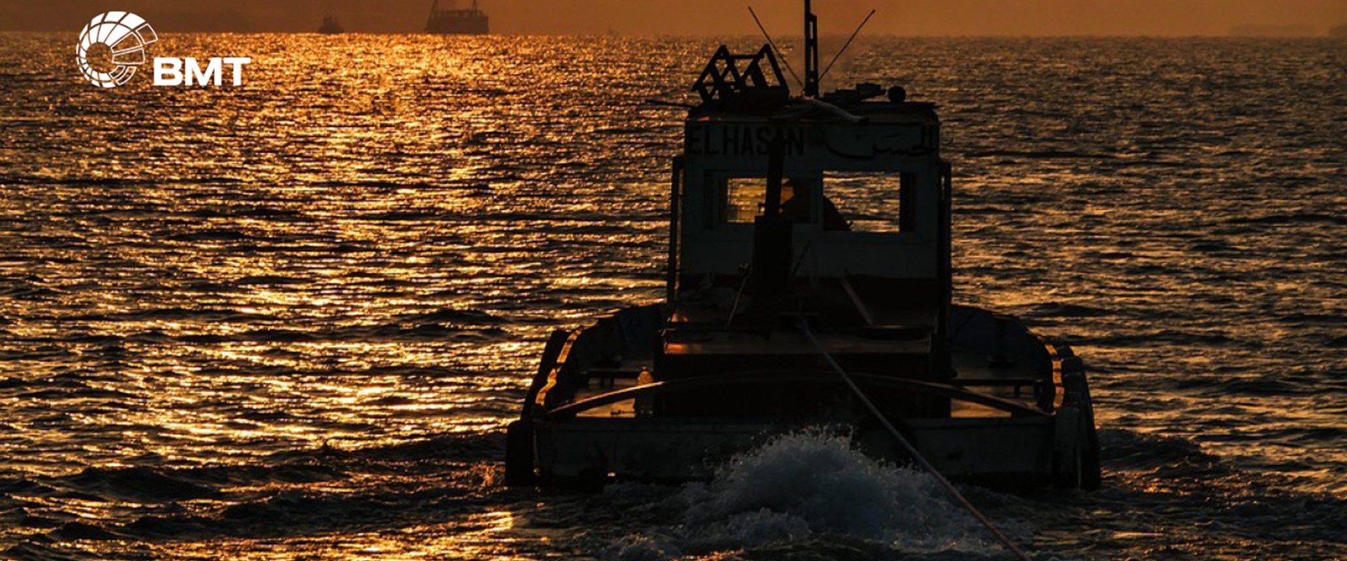 Picture of BMT designed tug at sunset