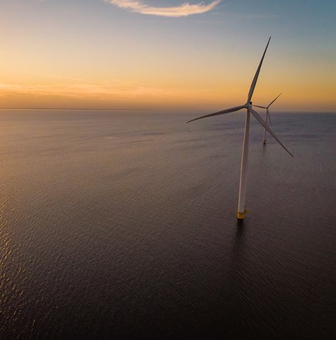 Offshore windfarm at sunset