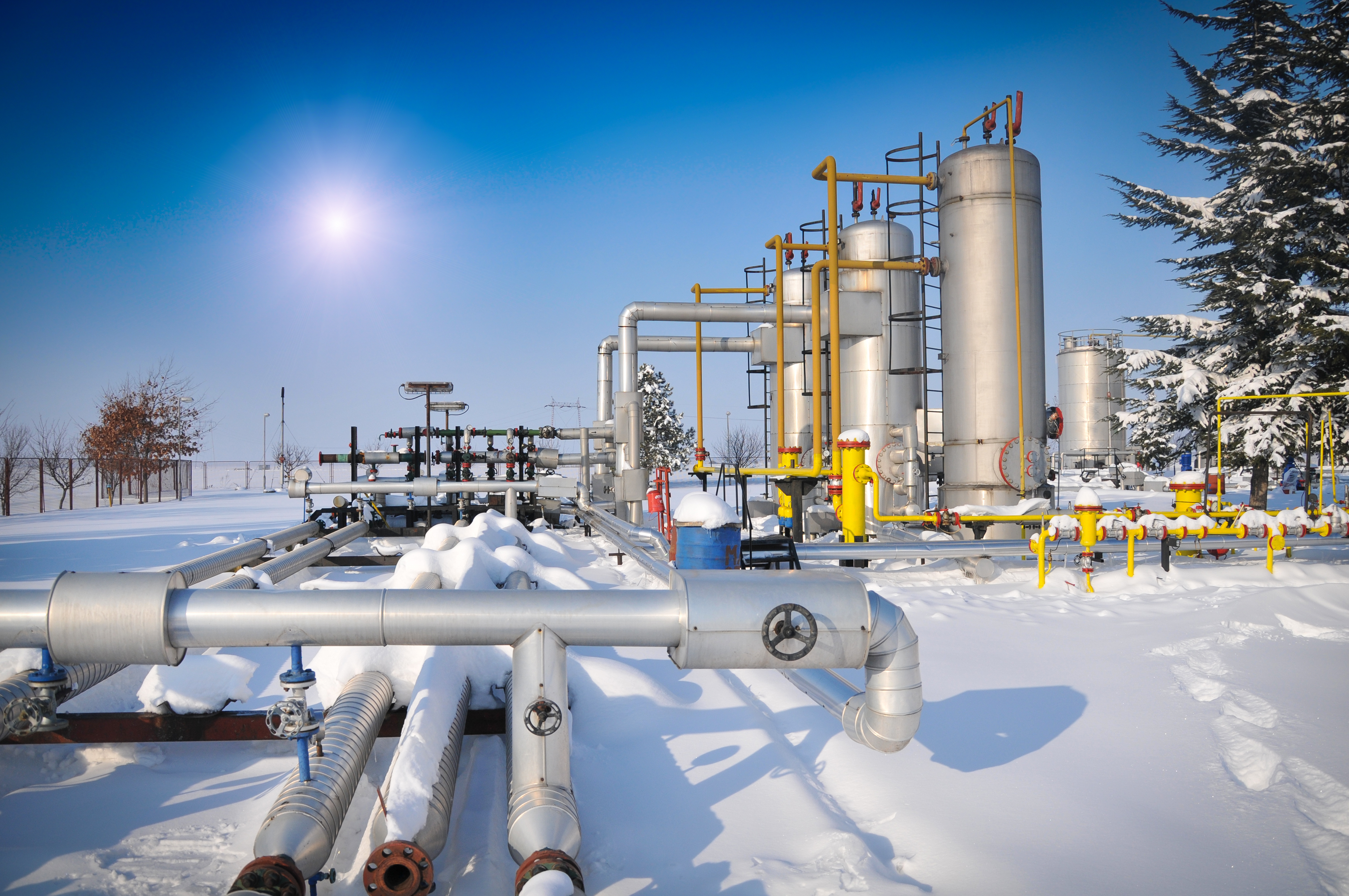 An image of pipelines in the snow