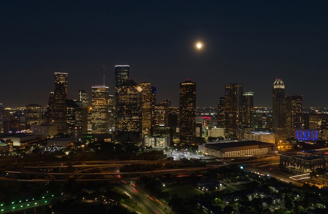 Skyline of Houston Texas at night with skyscrapers in background