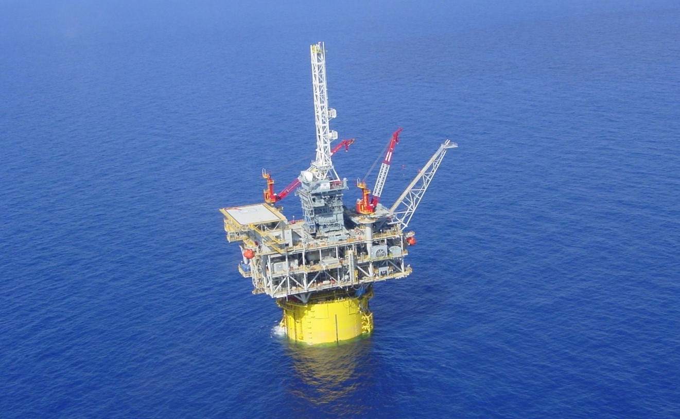 An image of an oil and gas platform in the sea