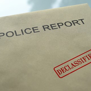 Declassified police report brown envelope