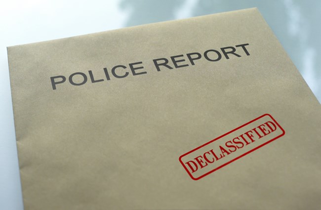 Declassified police report brown envelope