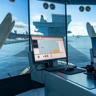 REMBRANDT Tug Simulator 1 featuring a set up with multiple screens surrounding the user for an immersive experience