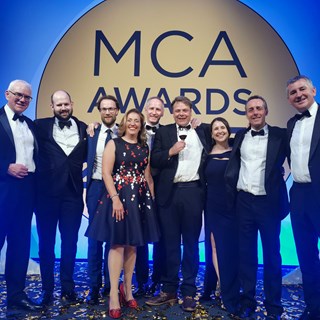 The BMT project teams on stage at the MCA Awards 2023