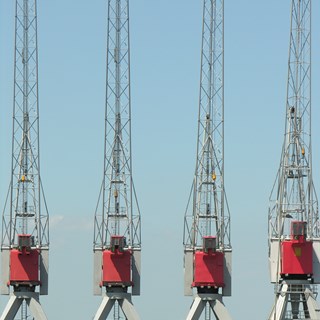a row of 4 empty crane cabins