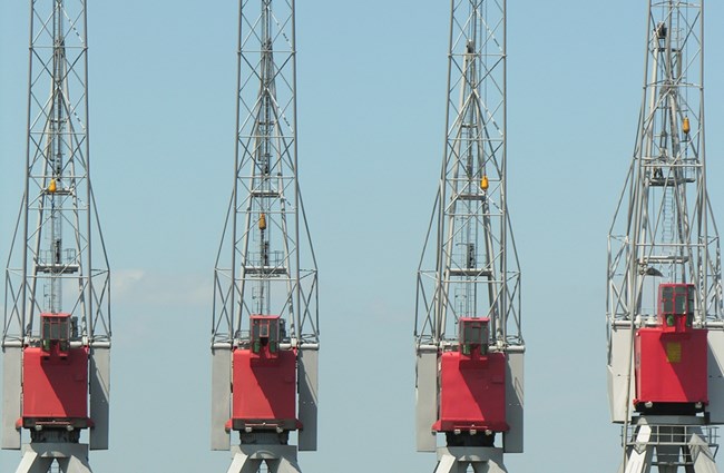 a row of 4 empty crane cabins